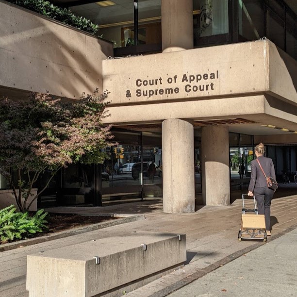 A person walks to the BC Supreme Court